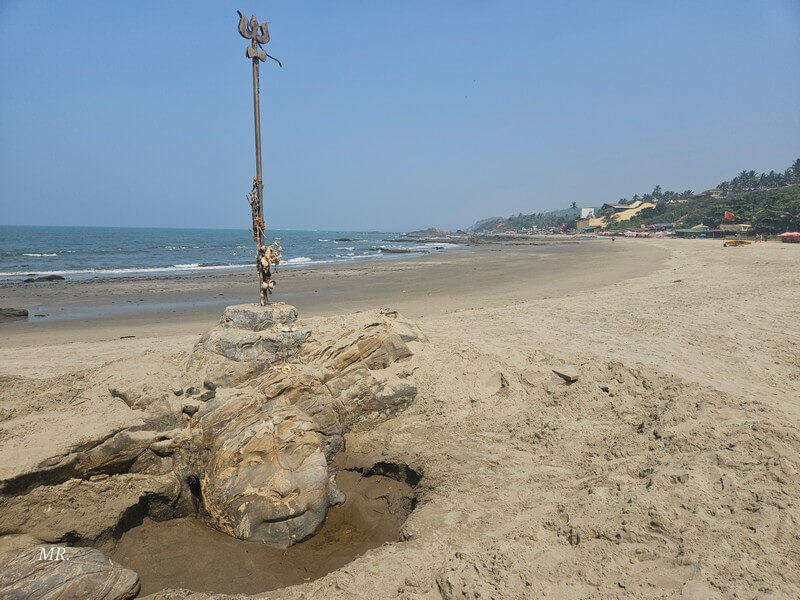 Travelers enjoying a beautiful beach in North Goa, India